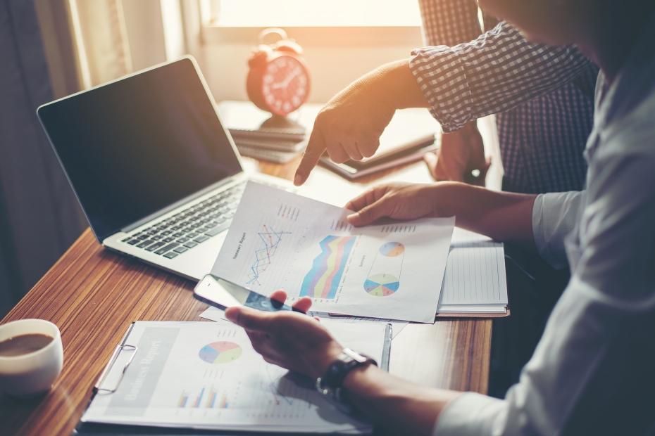 Executives look over charts