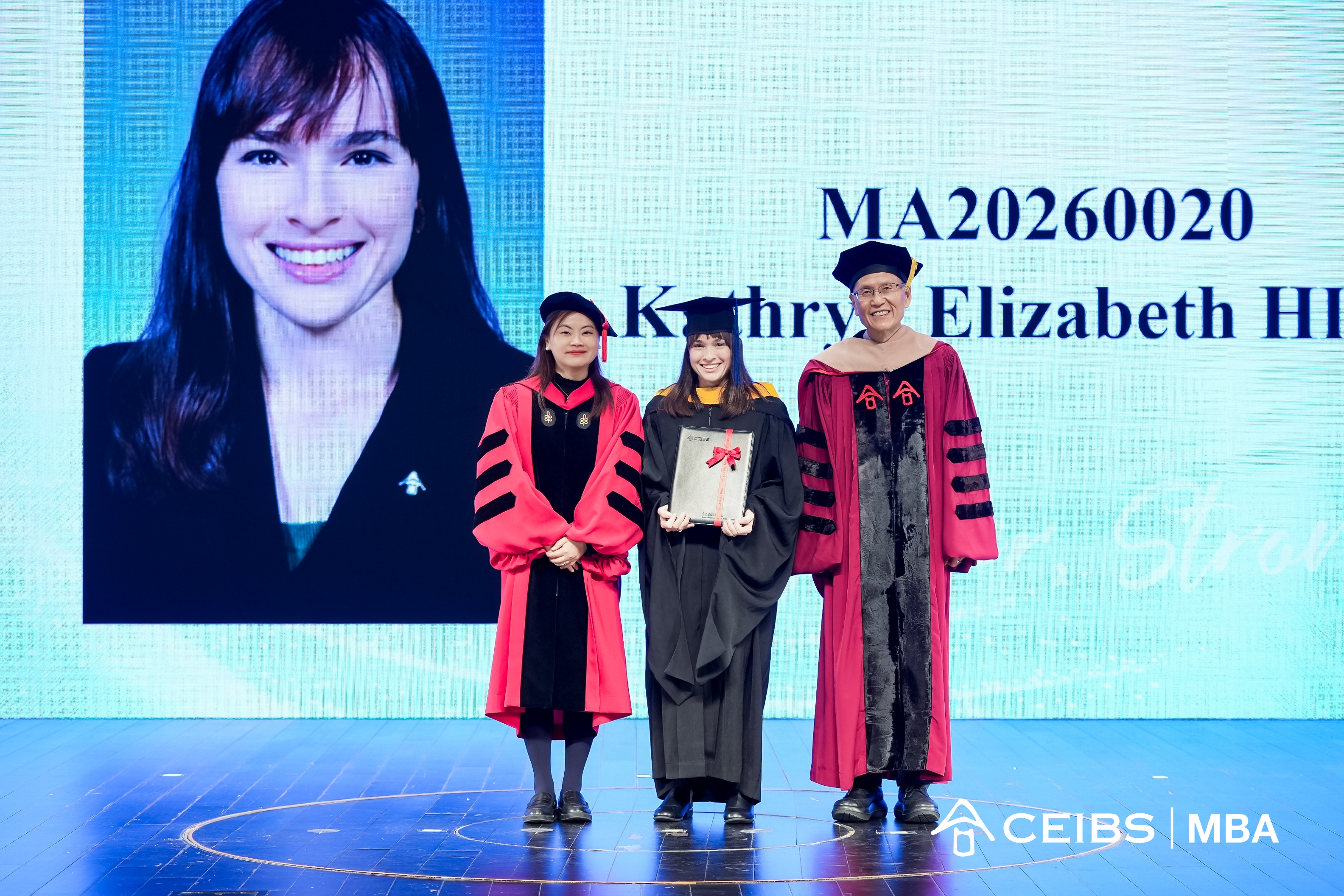 Professors present graduation certificates to graduates